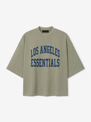 Rams Merch Tee gray short sleeve T shirt featuring bold blue Los Angeles Essentials collegiate lettering displayed against a light background in a clean Tops product view