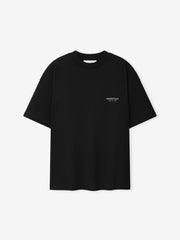 Essentials FW26 Classic Tee in black shown flat with short sleeves crew neckline and small tonal Essentials Fear of God chest logo Tops