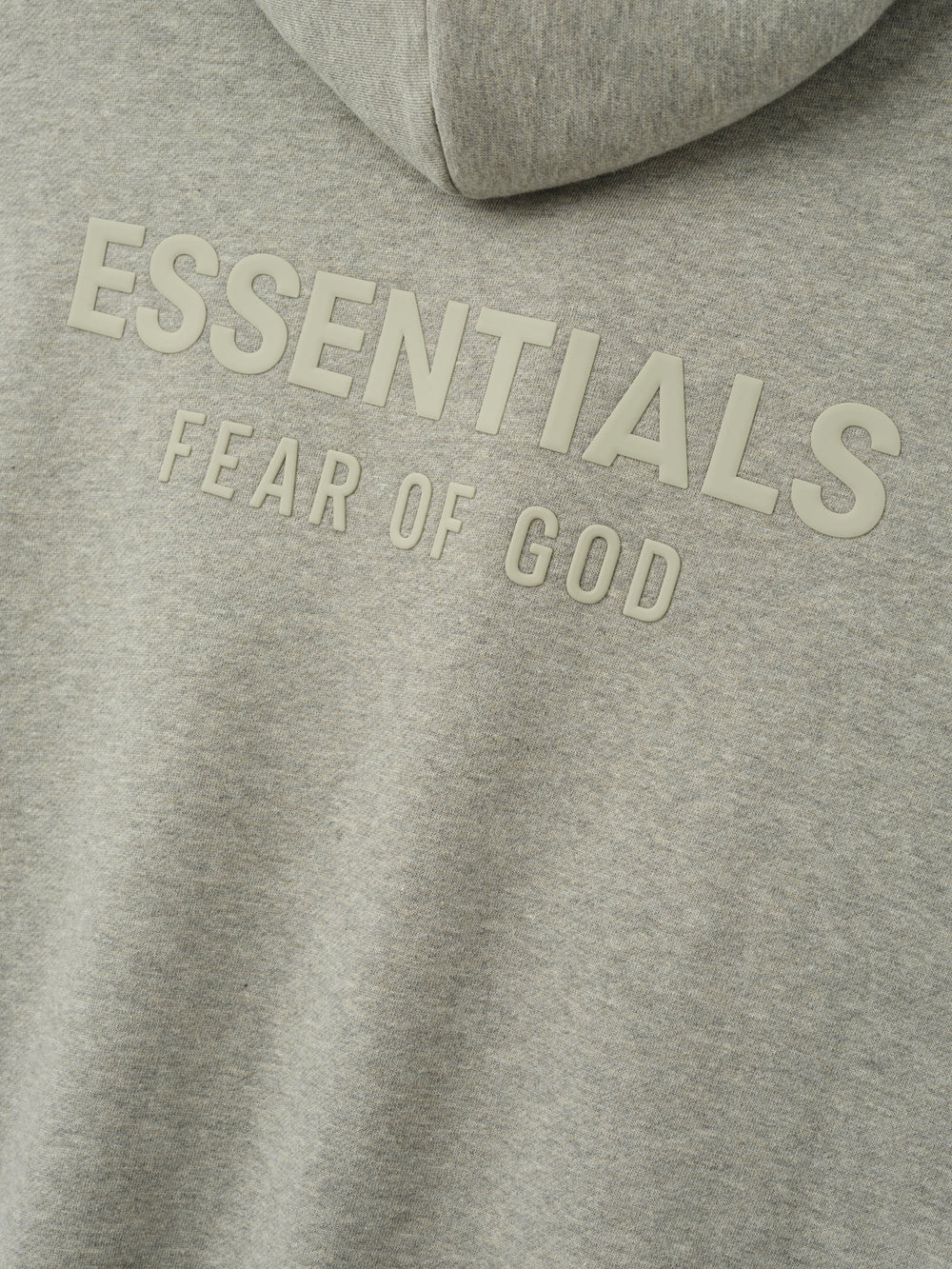 Essentials FW26 Classic Zip-Up Hoodie in heather gray close up with raised tonal Essentials Fear of God chest branding on soft fleece fabric Tops